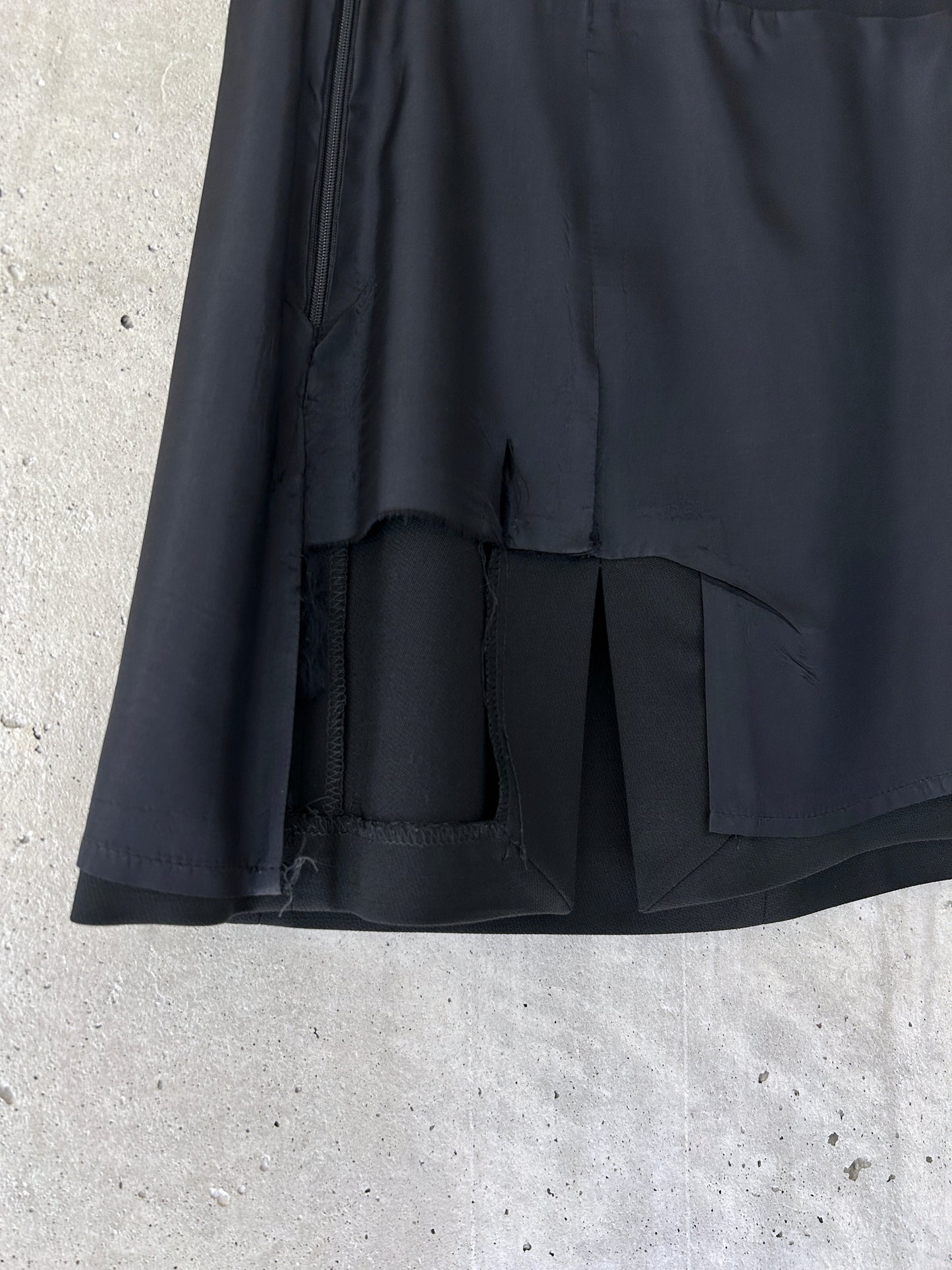 Holt Renfrew black wool mini skirt with slit hem