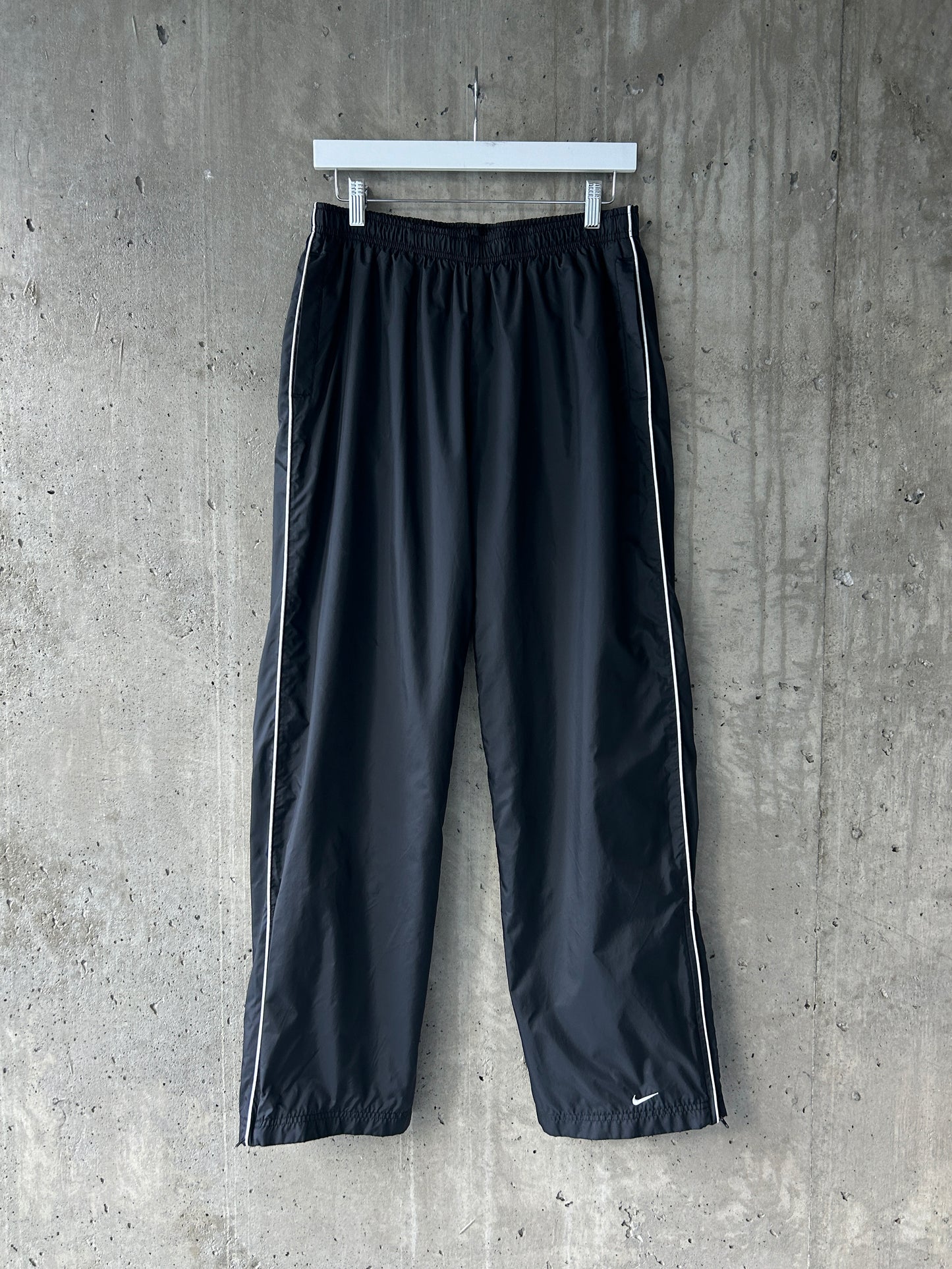 Nike black nylon ankle-zip track pants with white piping