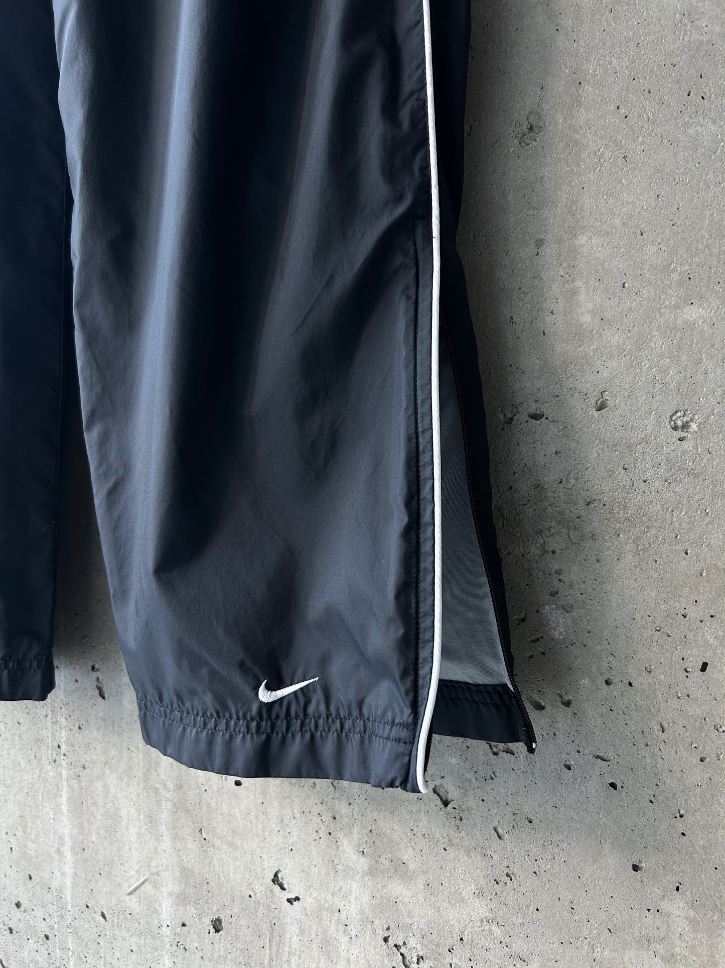 Nike black nylon ankle-zip track pants with white piping