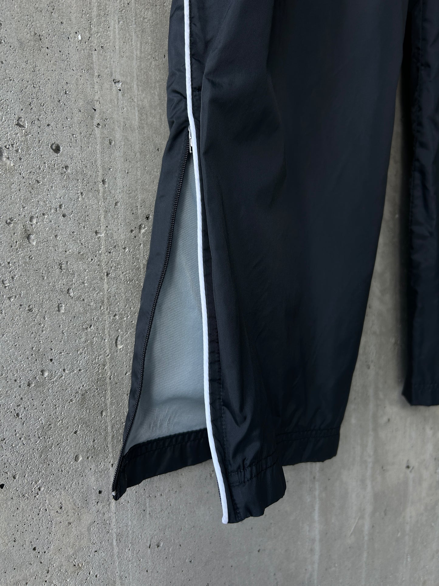 Nike black nylon ankle-zip track pants with white piping