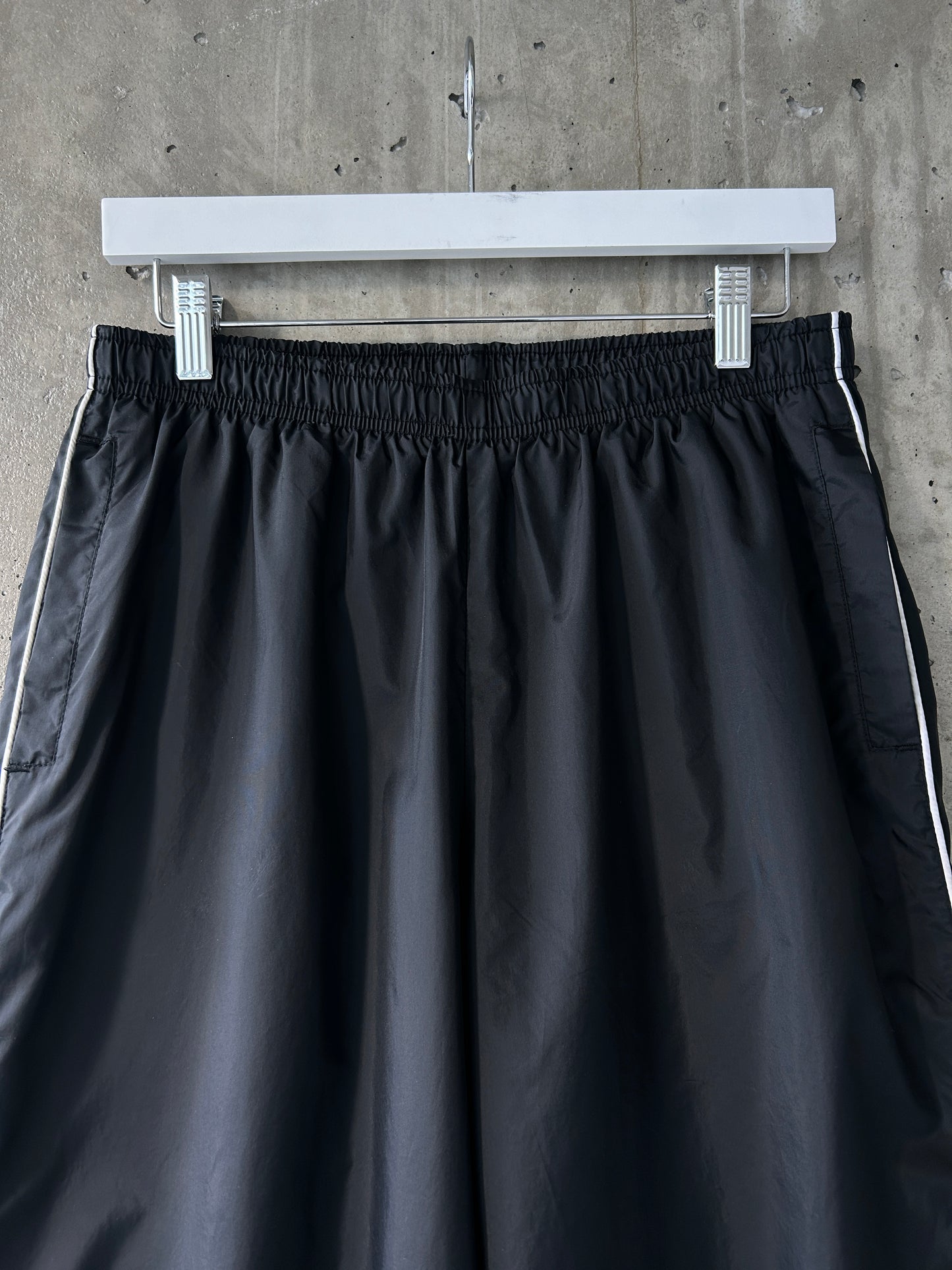 Nike black nylon ankle-zip track pants with white piping