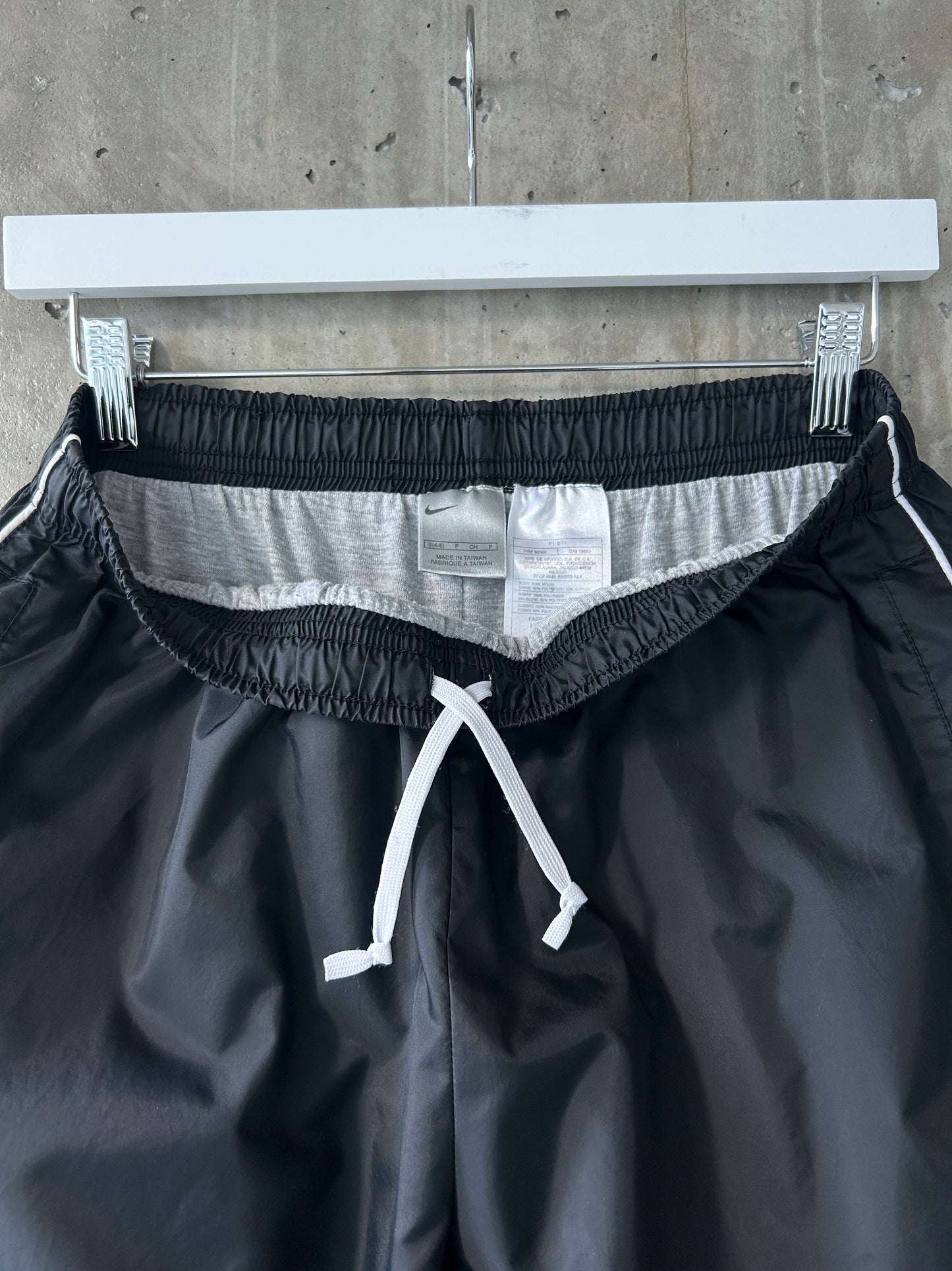 Nike black nylon ankle-zip track pants with white piping