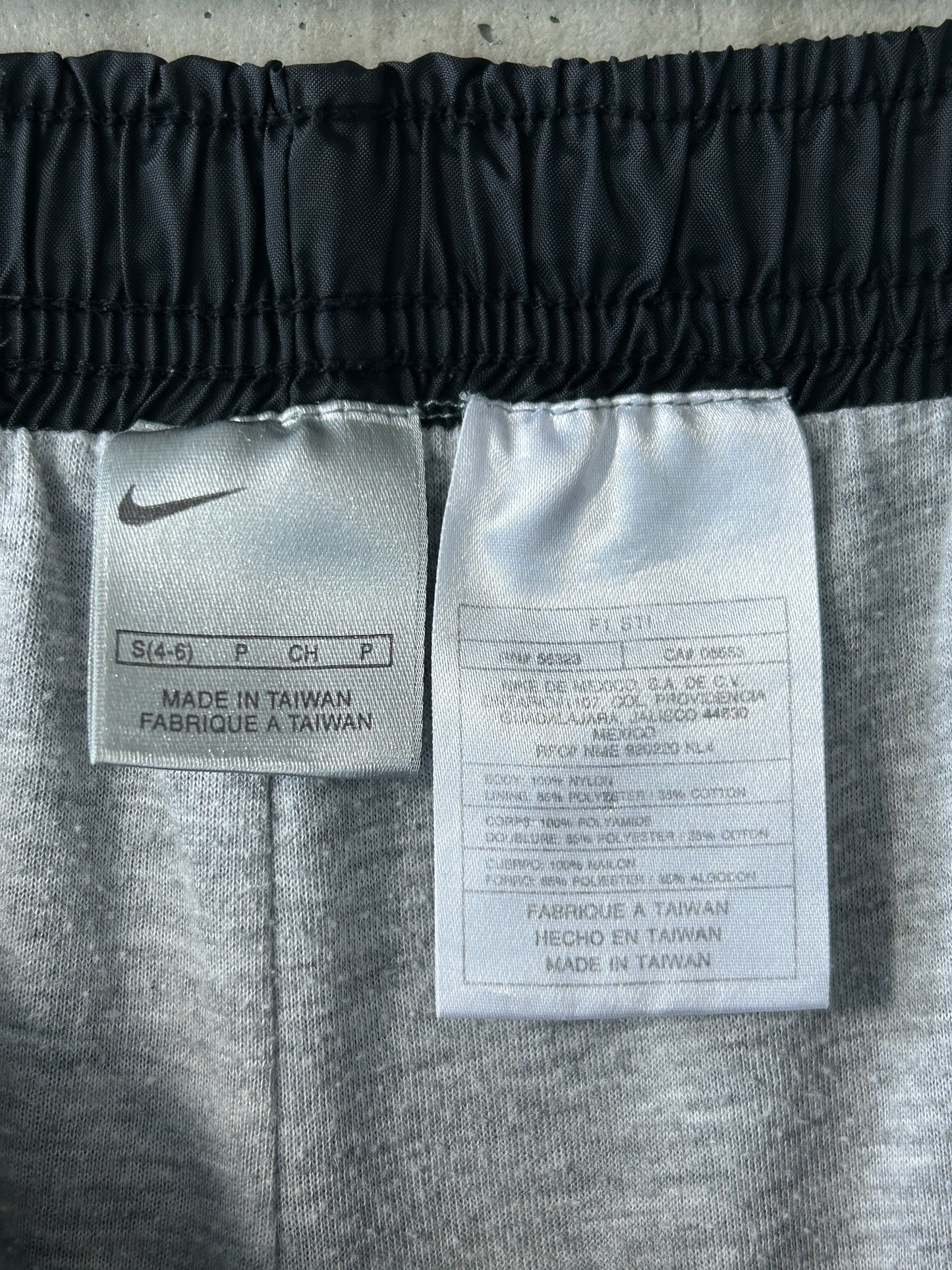 Nike black nylon ankle-zip track pants with white piping