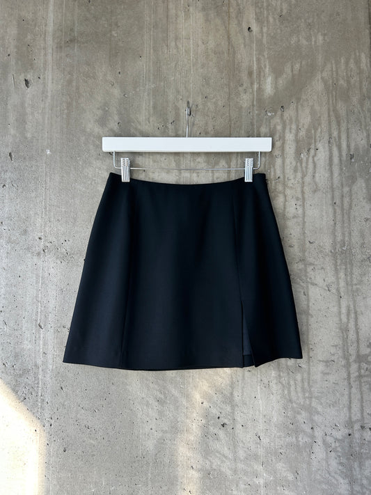 Holt Renfrew black wool mini skirt with slit hem