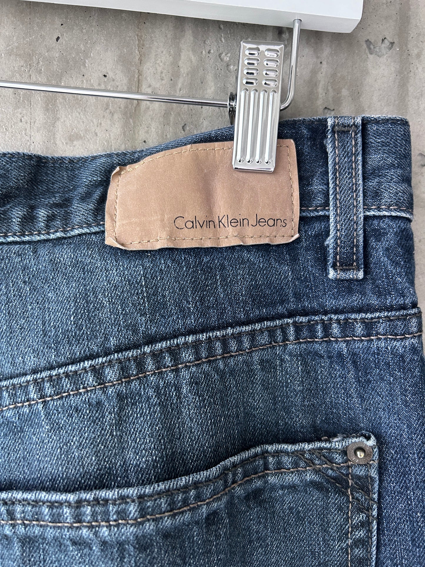 Calvin Klein blue mid-dark wash denim relaxed straight leg jeans