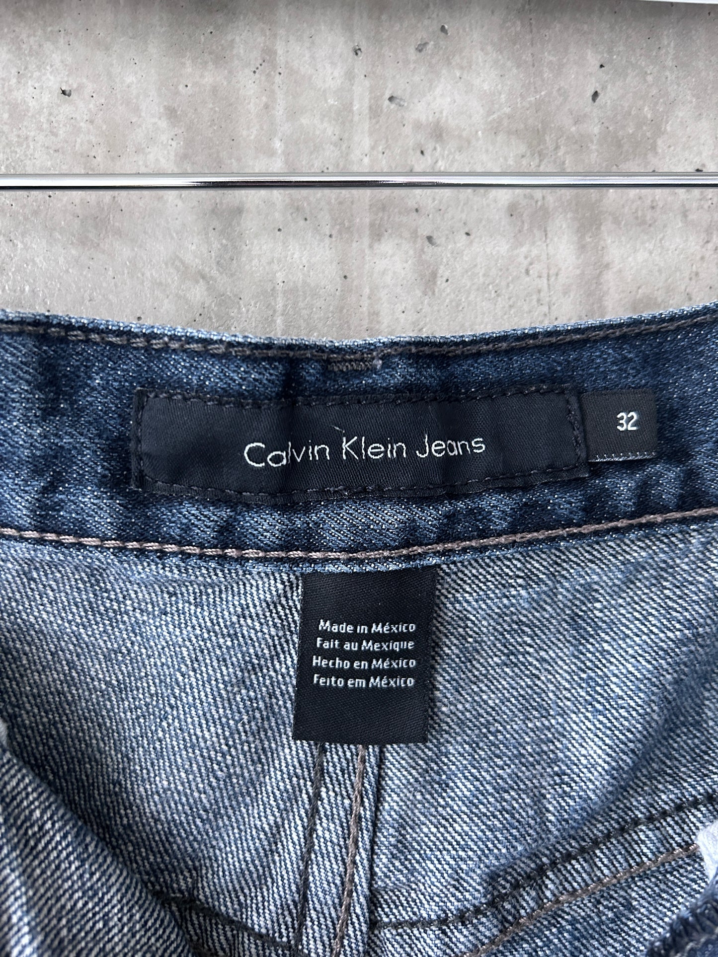 Calvin Klein blue mid-dark wash denim relaxed straight leg jeans