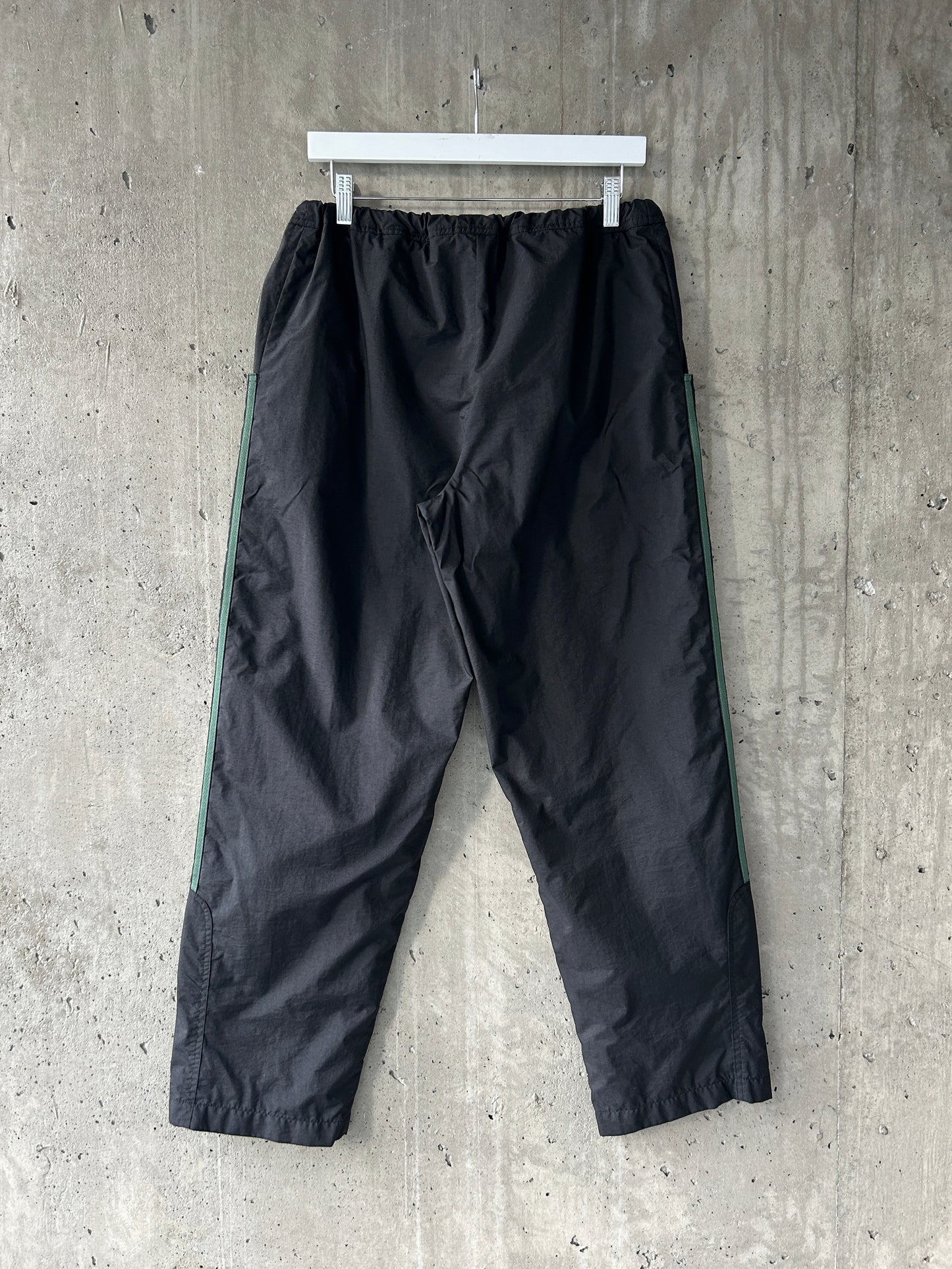 adidas black nylon track pants with green stripes