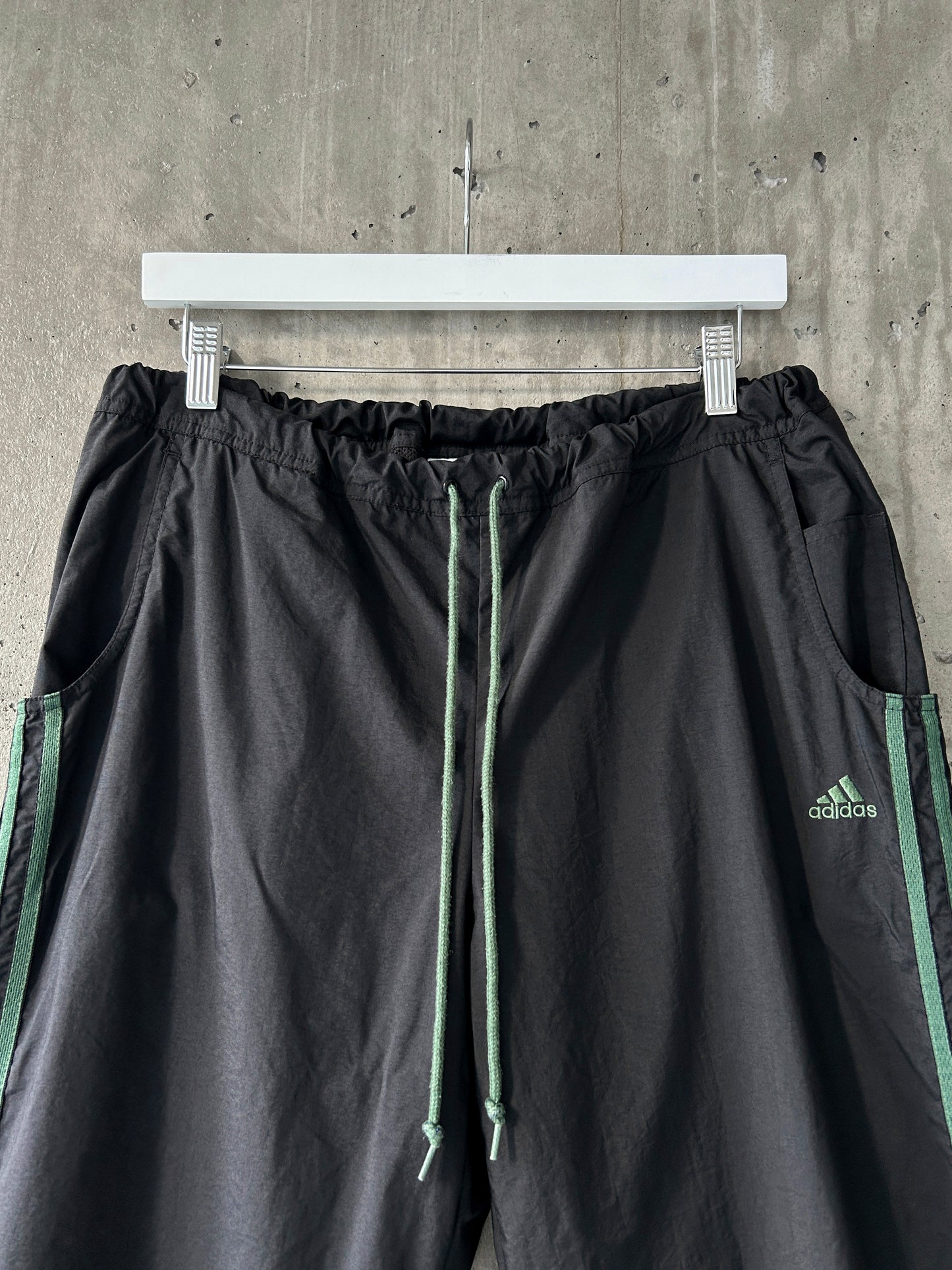 adidas black nylon track pants with green stripes