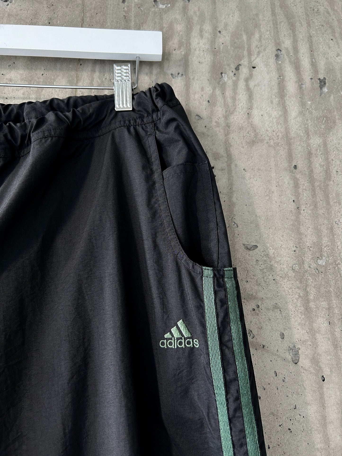 adidas black nylon track pants with green stripes