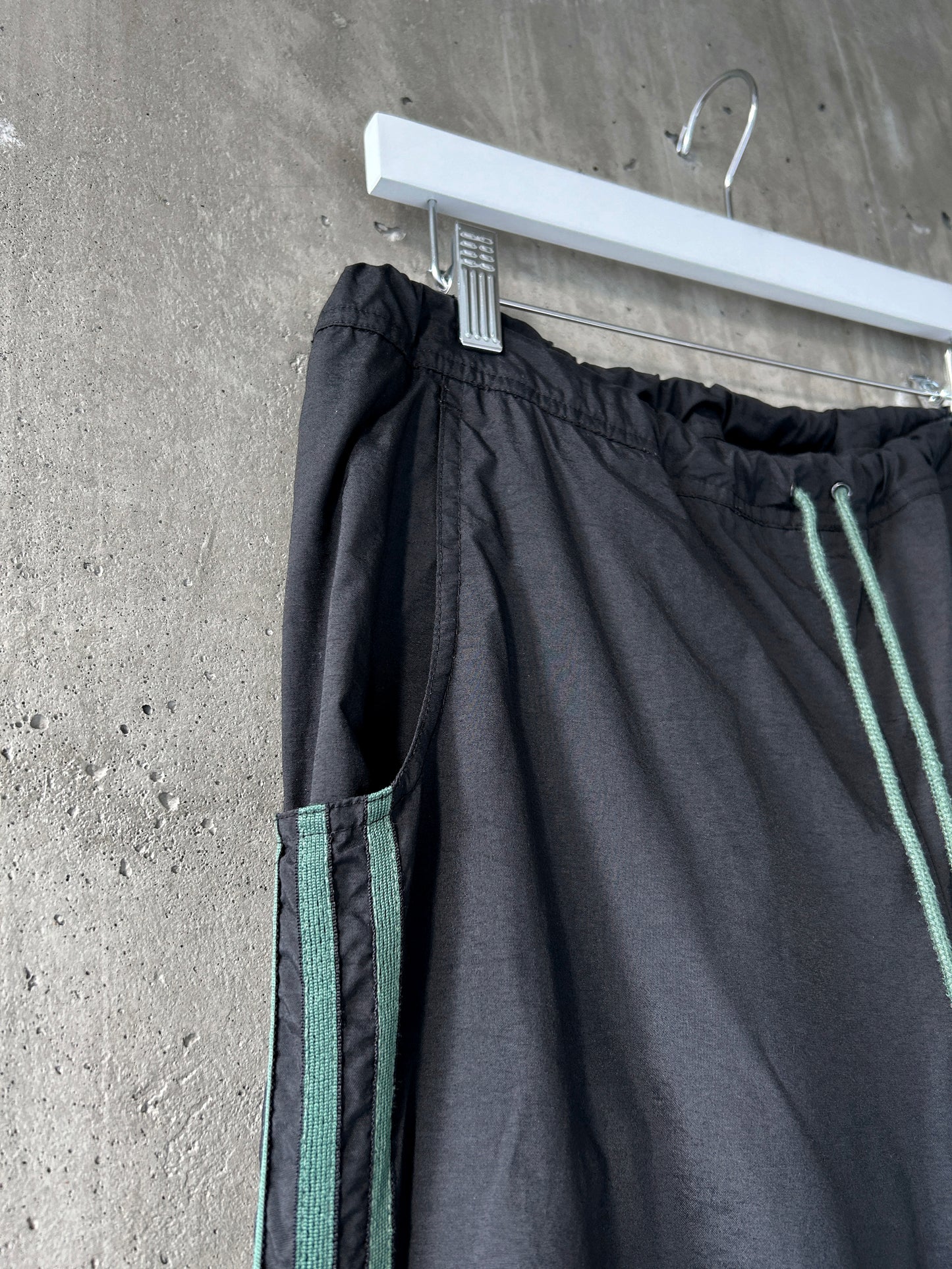 adidas black nylon track pants with green stripes