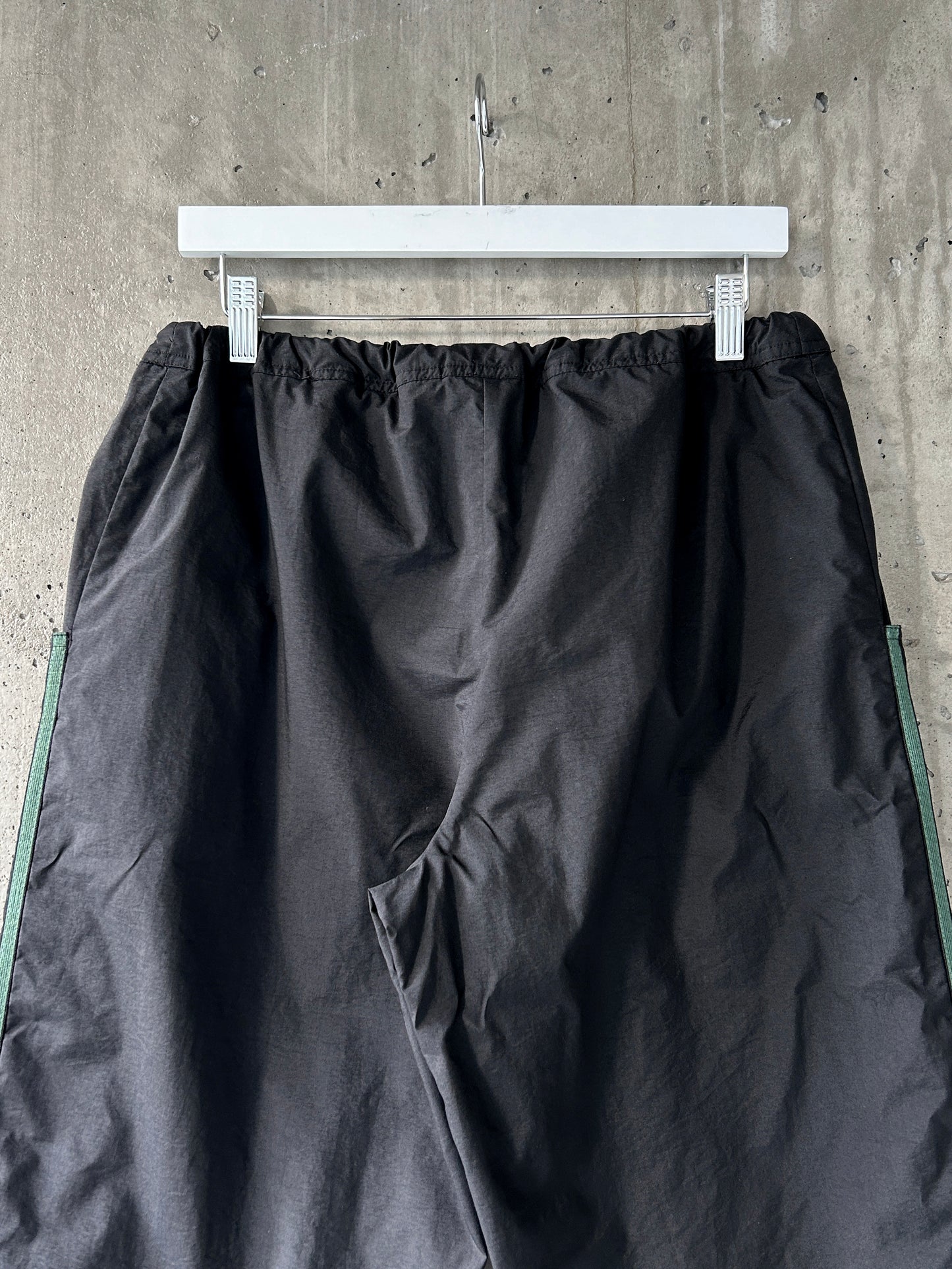 adidas black nylon track pants with green stripes