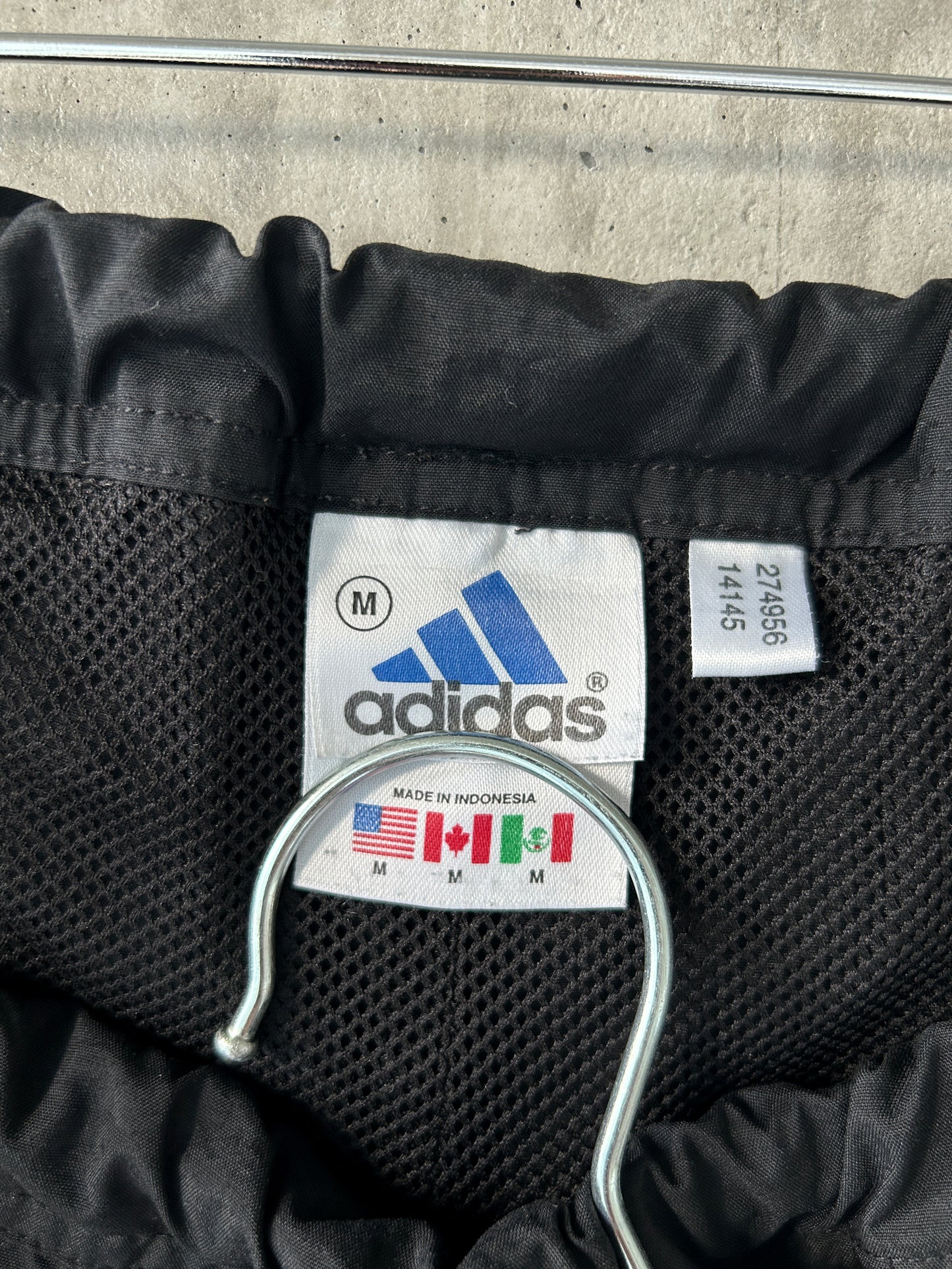 adidas black nylon track pants with green stripes
