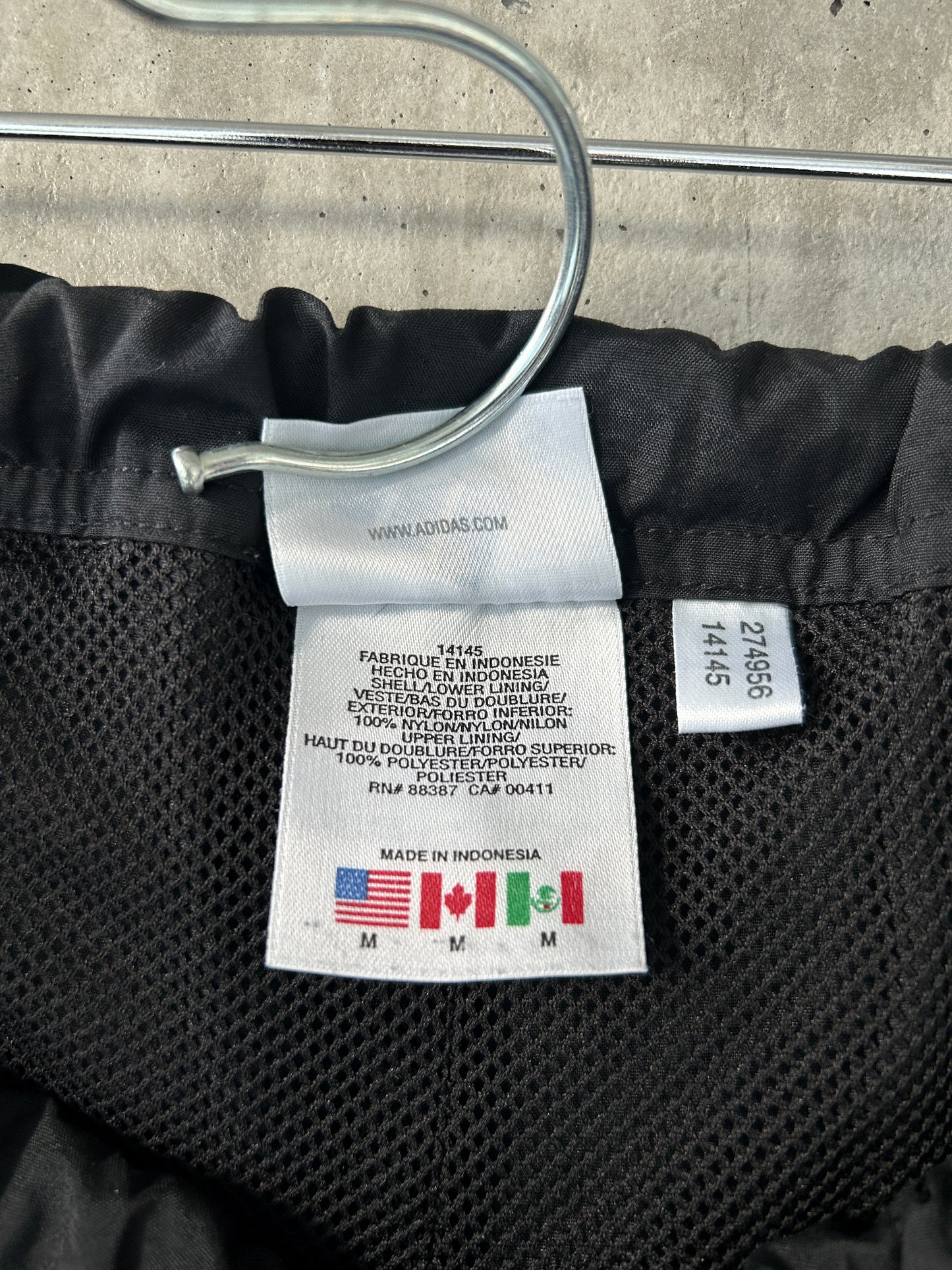 adidas black nylon track pants with green stripes