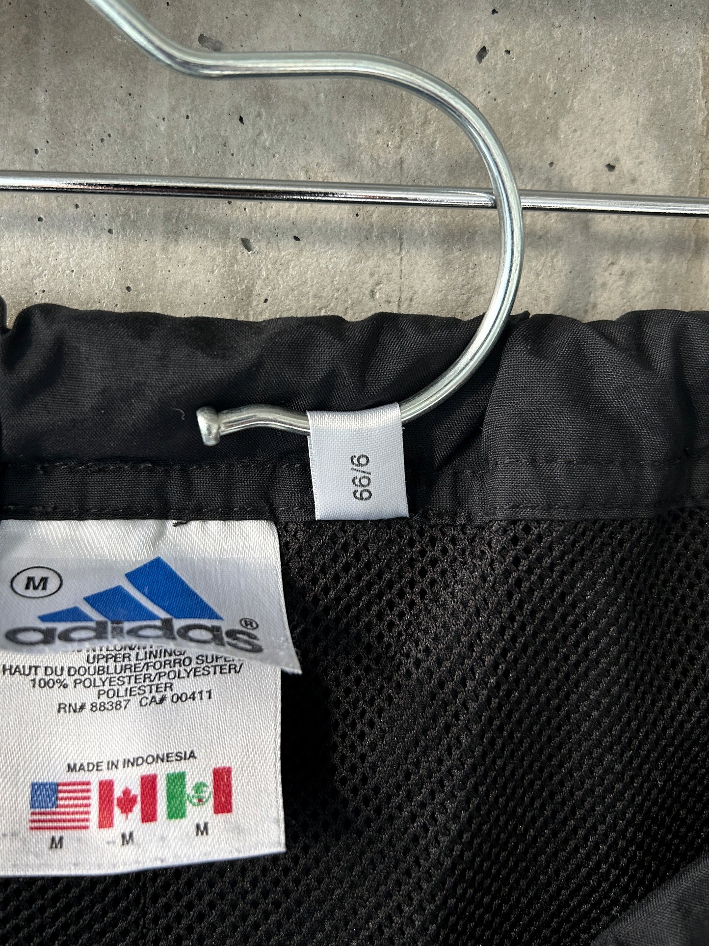adidas black nylon track pants with green stripes